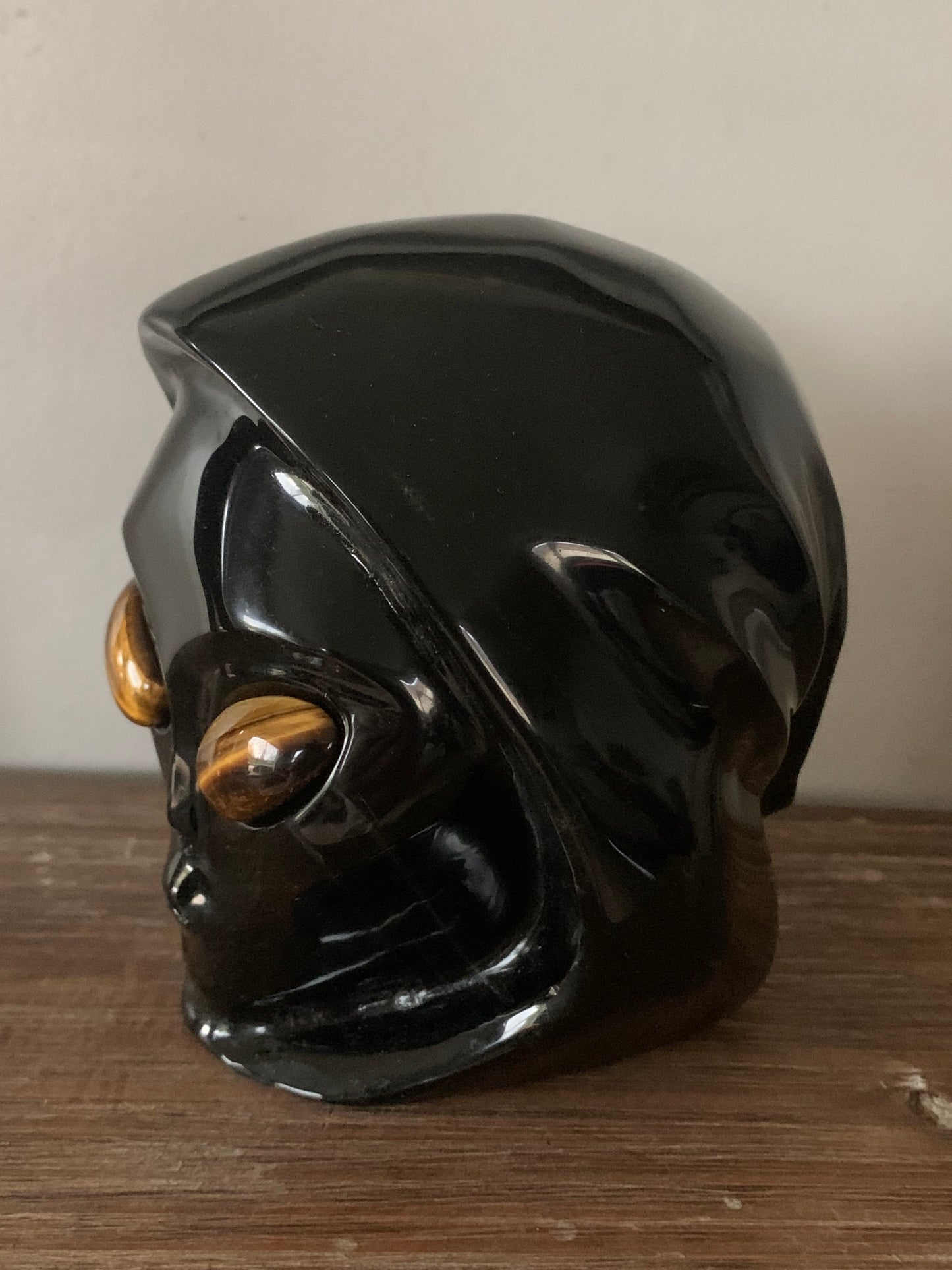 Crane de cristal stellaire en obsidienne noire et oeil de tigre